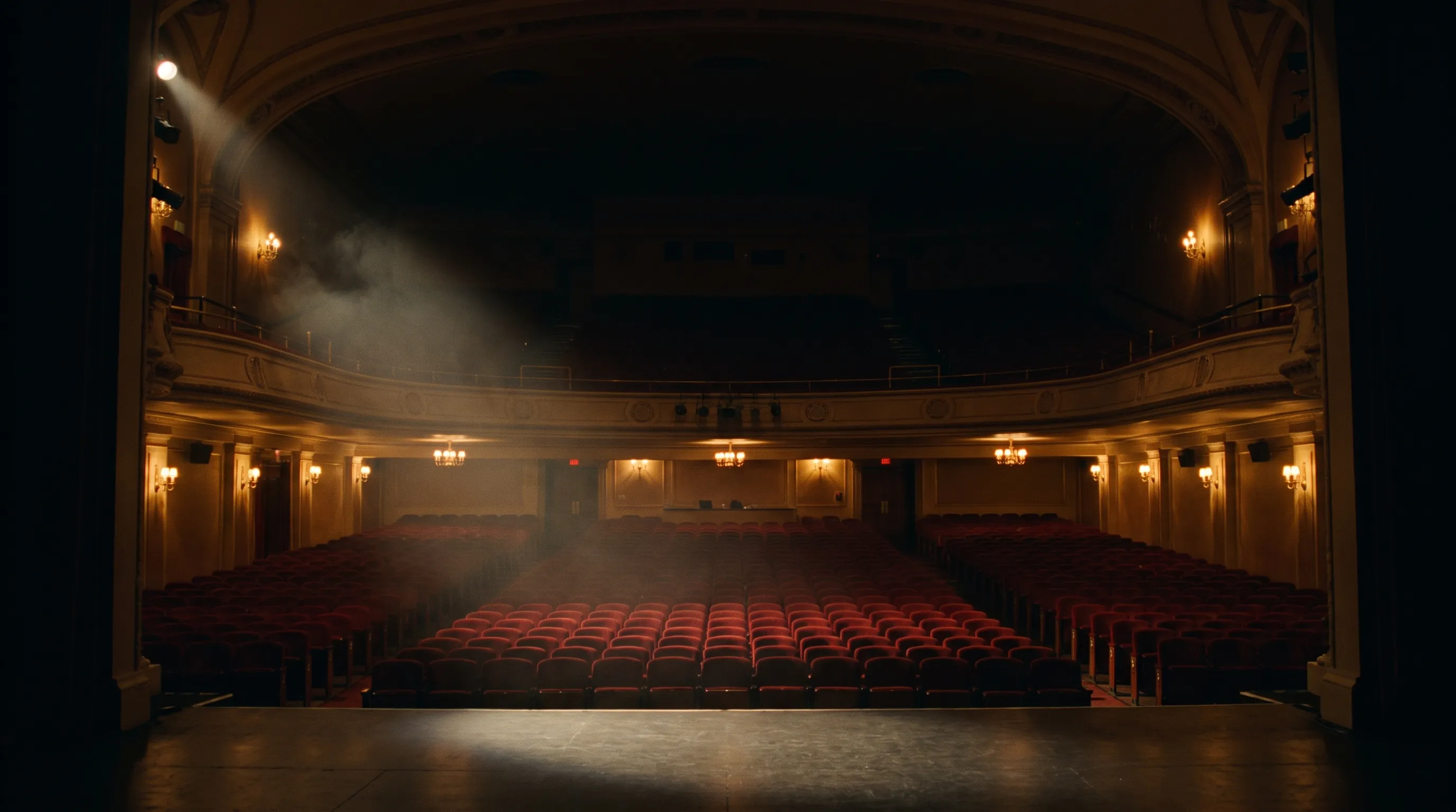 Illustrative empty theater auditorium with warm house lights